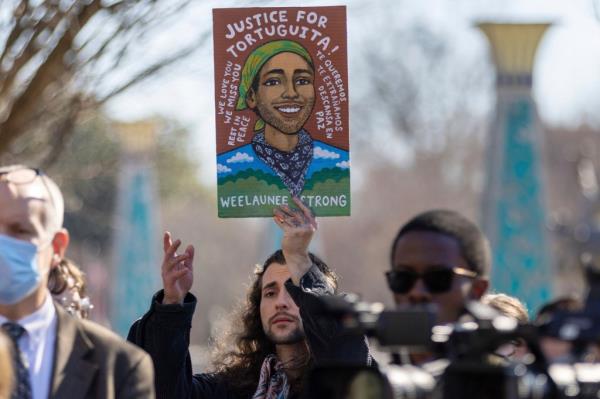 Noah Gringi holds a sign at a news conference for Manuel Esteban Paez Terán in Decatur, Ga., Monday, Feb. 6, 2023.