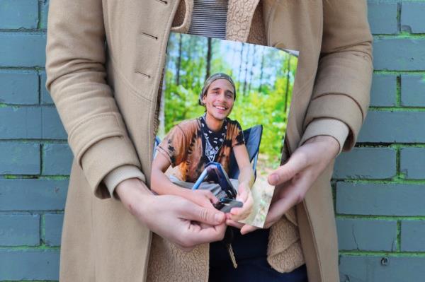 Vienna holds a photo of their slain partner, Tortuguita, in Atlanta on Thursday, Jan. 26, 2023.