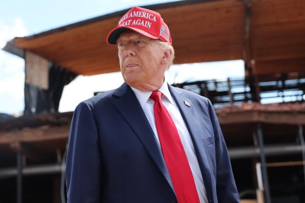 Former President Donald Trump addressing local officials and affected residents at Chez What Furniture Store, which was damaged in Hurricane Helene, in Valdosta, Georgia.